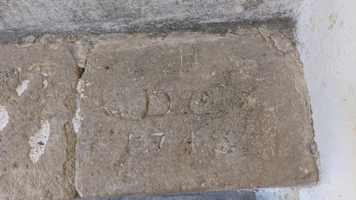 DC - carved into porch seat - who was he